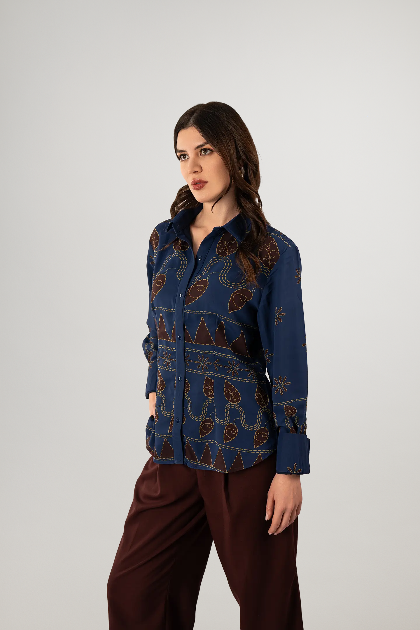 Side pose in Kantha Story Shirt with maroon stitched-look print – Indian art reimagined through digital design